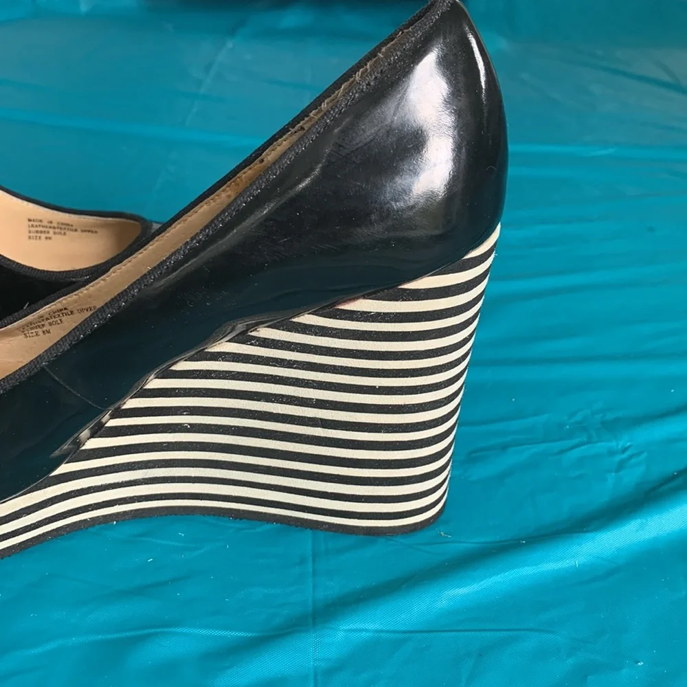 Gently worn Michael Kors Adlai’s Black and Cream Strip Wedge Shoes.